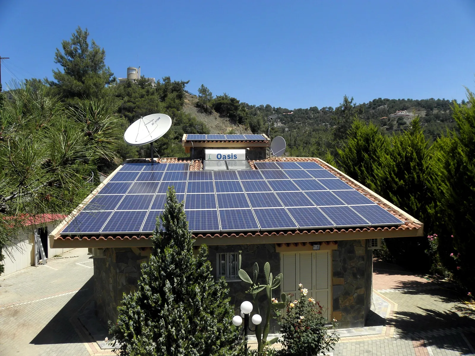A rooftop solar installation on a stone villa in Cyprus by EcoSun